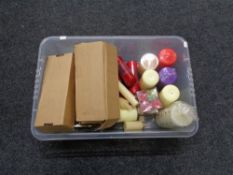 A box containing various scented candles, candle holders etc.