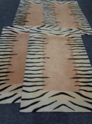 Four contemporary zebra print pattern rugs