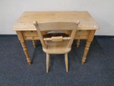 A pine writing desk and chair