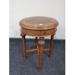 A small carved walnut circular table