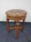 A small carved walnut circular table