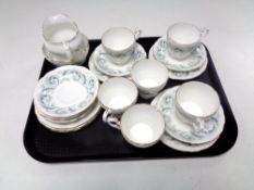 A tray containing 20 pieces of Royal Standard Garland fine bone tea china.