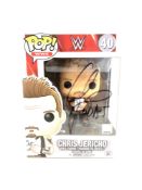 A Funko Pop WWE figure 'Chris Jericho', signed, height of box 16 cm.