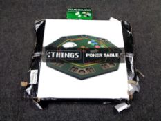 A poker table in box together with a boxed Texas Holdem card shuffler.