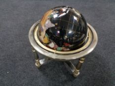A Gemstone globe on stand, height 44 cm.
