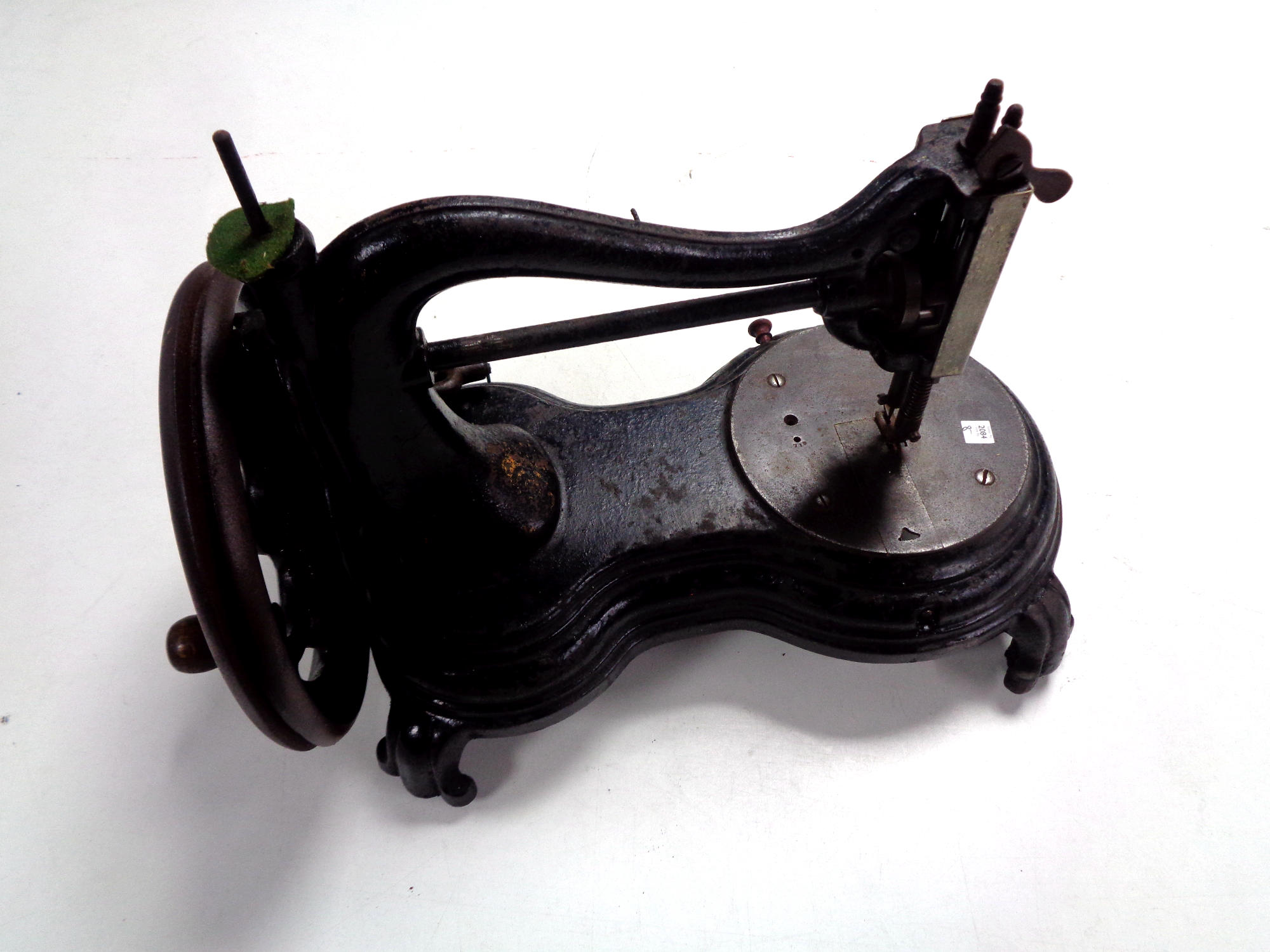 An antique hand sewing machine.