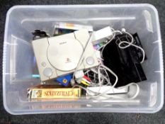 A box containing Sony PlayStation I, Nintendo Wii, various games, USB microphone.