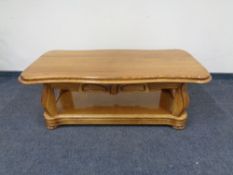 A contemporary shaped oak coffee table