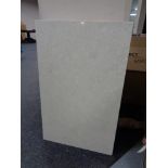 A rectangular cream marble table top
