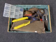 A box containing a large quantity of assorted hand tools, grinding disks, circular saw blades etc.