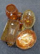 A tray containing a collection of amber glassware including pair of candlesticks, vase,