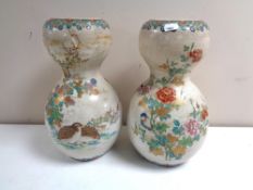 A pair of Japanese earthenware double gourd shaped vases, height 31 cm.