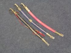 Three brass handled Indian swords in scabbards