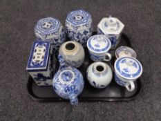 A tray of 20th century blue and white porcelain including a pair of hexagonal barrel vases, teapots,
