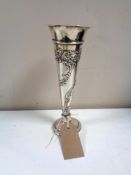 A tall fluted silver vase, height 20 cm.