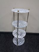 A painted cast iron four tier pan stand