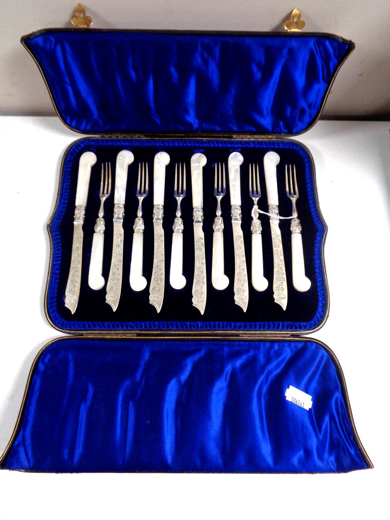 A set of twelve late Victorian silver fish knives and forks with mother of pearl pistol grips in a