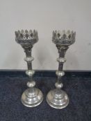 An ornate pair of silver plated pricket candlesticks,