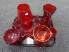 A tray containing a quantity of ruby glassware including vases,