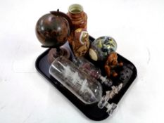 A tray containing a globe, ship's in bottles, Russian doll, Price Kensington vase etc.