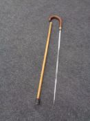 A silver mounted sword stick with etched single fullered blade signed Wilkinson, Pall Mall.