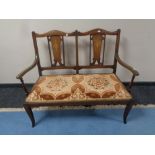 A late Victorian inlaid mahogany two seater salon settee