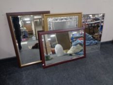 A contemporary all glass bevel edged rectangular mirror together with a gilt framed mirror and two