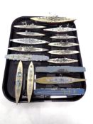 A tray containing 16 die cast battleships on stands.