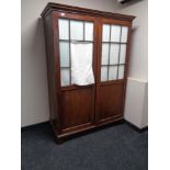 A 19th century mahogany double door hanging wardrobe with glass panel doors (a/f)