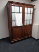 A 19th century mahogany double door hanging wardrobe with glass panel doors (a/f)