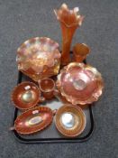 A tray containing a collection of orange petrol glass including shaped dishes, twin handled bowl,