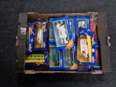 A box containing a collection of boxed Corgi die cast vehicles, delivery vans etc.