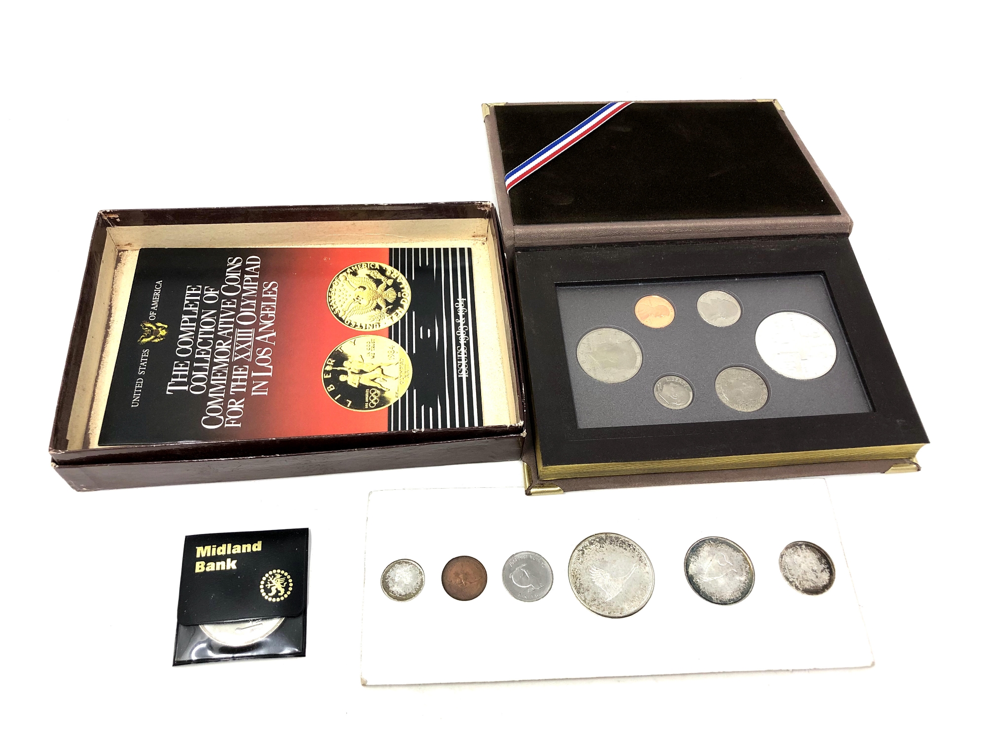 A collection of various silver coins and coin sets