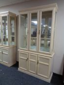 A contemporary glazed mirrored back display cabinet