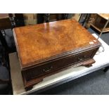 A burr elm veneered single drawer low table with brass bow handles