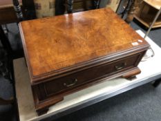 A burr elm veneered single drawer low table with brass bow handles