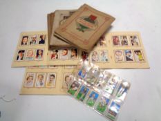 A box containing a very large quantity of cigarette cards in albums