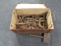 A metal military chest containing vintage woodworking tools, folding rule,