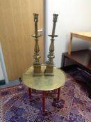 A folding eastern brass topped table together with two brass table lamps (continental wiring)