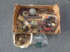 A box containing assorted hand tools, vintage measures,