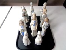 A tray containing eleven Spanish figurines