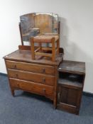 An Edwardian oak three drawer dressing chest together with a rush seated stool and an oak bedside