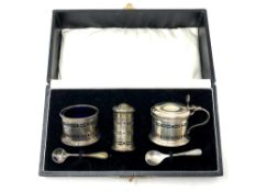 A cased silver cruet set,