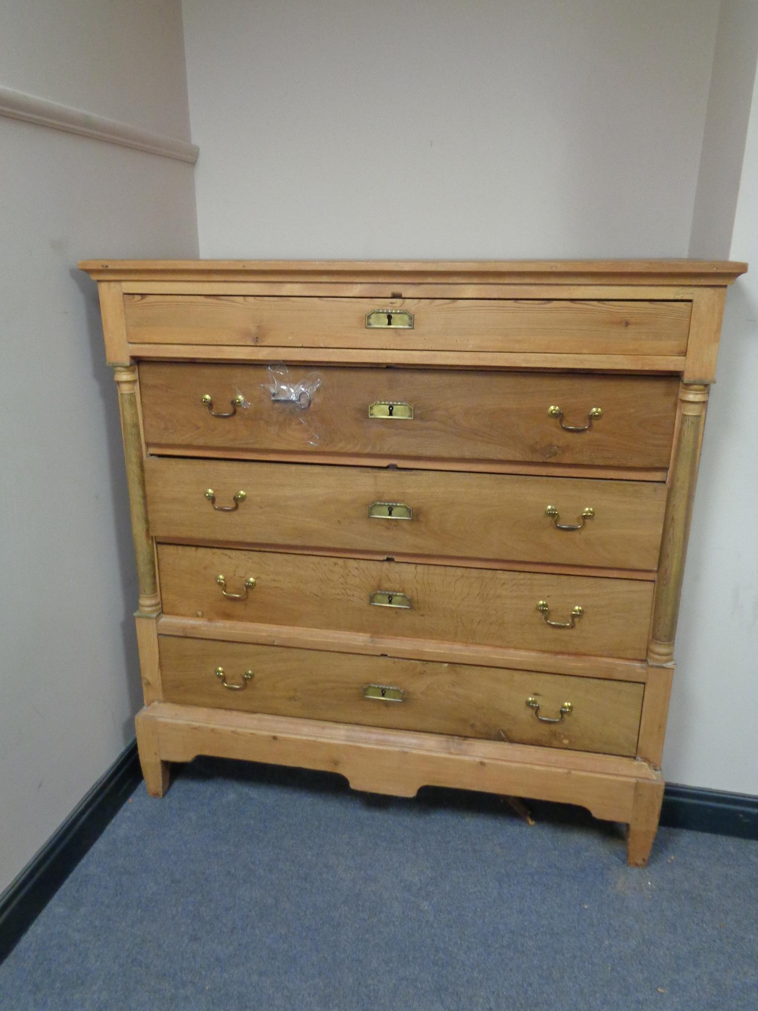 A 19th century pine five drawer chest with brass drop handles