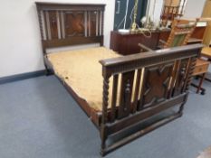 An early 20th century 4' 6" Waring & Gillow Ltd oak barley twist bed frame with Staples Silex
