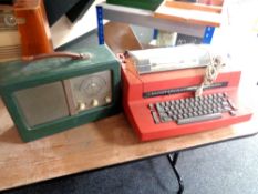An IBM electric typewriter (continental wiring) together with a green leather cased receiver