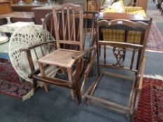 An Ercol wingback armchair (as found) together with an Edwardian folding chair (as found),