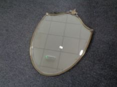 An Edwardian chrome framed shield bevel edged mirror