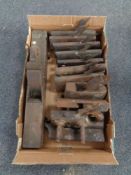 A box containing a quantity of vintage woodworking planes and a Gladstone bag