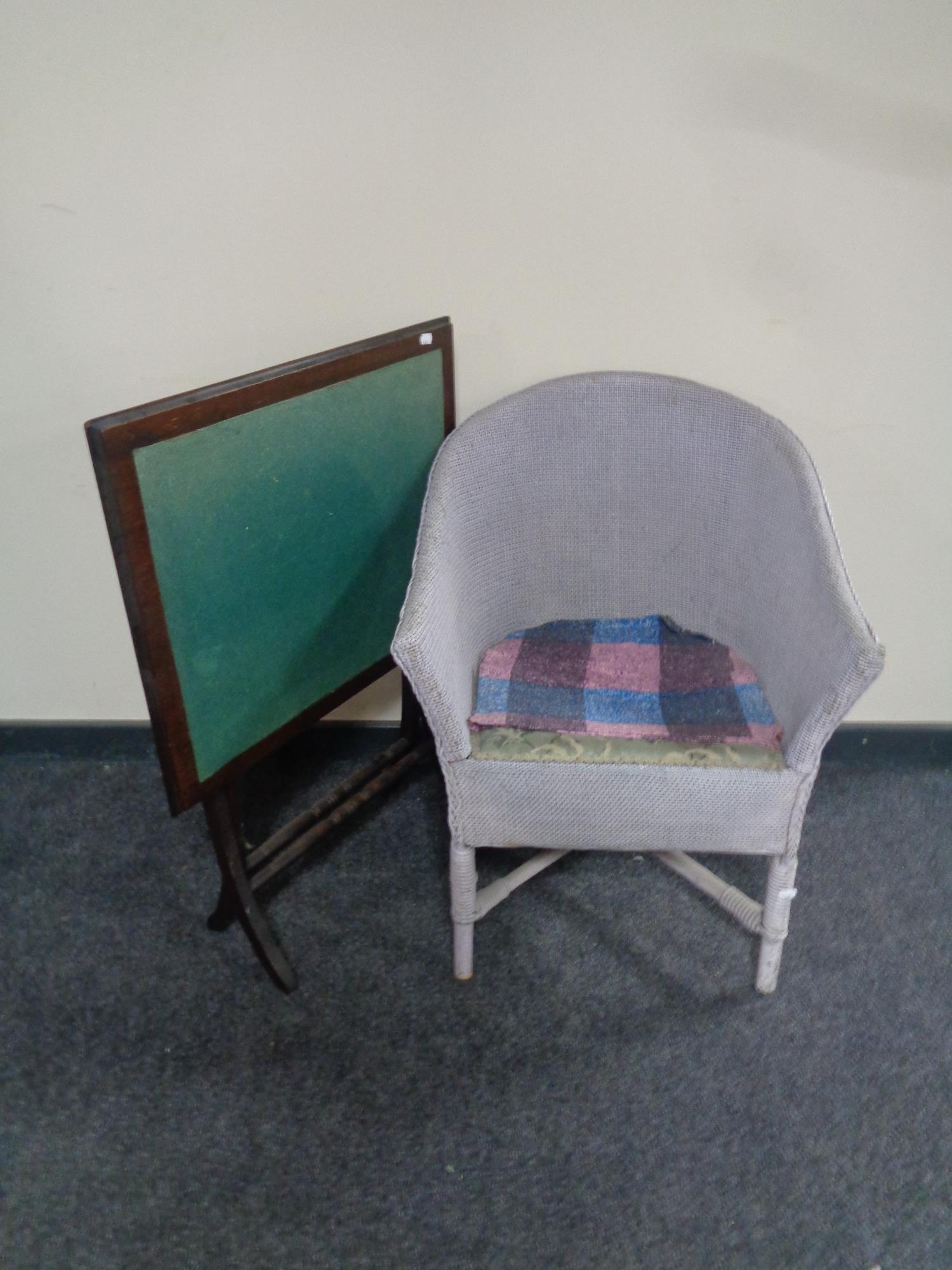 A folding Edwardian baize topped card table together with a loom armchair